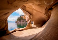 Image of sandstone cave at BC’s Galiano Island. Postage Paid mark upper right. 