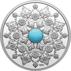 Silver coin featuring a simulated turquoise surrounded by engraved patterns that celebrate the cultural heritage of Iranian Canadians.