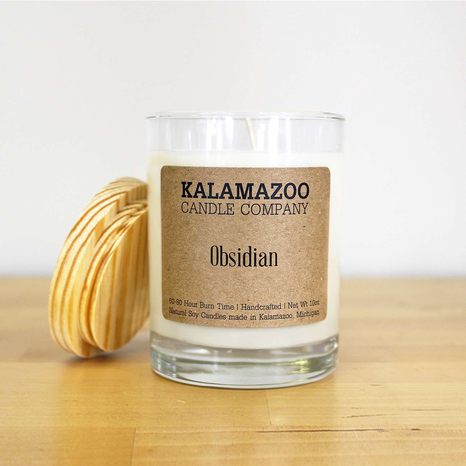 Kalamazoo Candle Company Clear glass jar with white soy wax, wood lid Obsidian Scent Obsidian