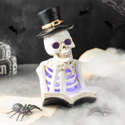 Glitzhome Multicolored 10 in. LED Prelit Skull Reading Book Halloween Decor