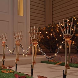 Celebrations Warm White 18 in. LED Prelit Chained Skeleton Arms Pathway Decor