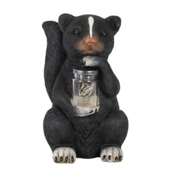 Exhart WindyWings Resin Black 10 in. Skunk with LED Firefly Jar Statue