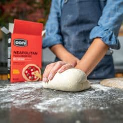 Man kneading Ooni's Neapolitan dough