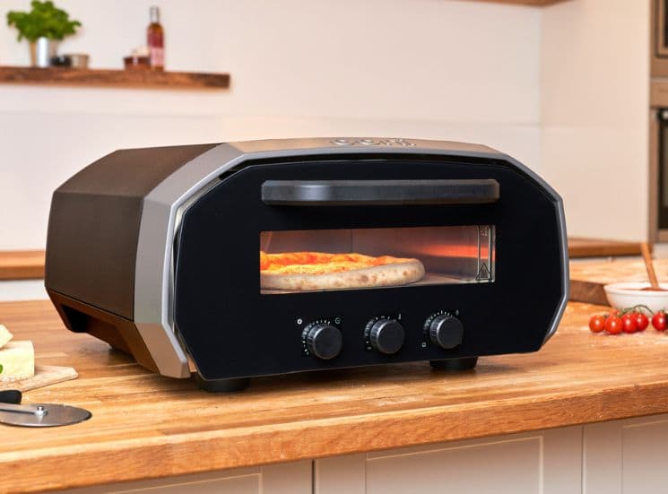 Pizza baking in Ooni electric volt oven