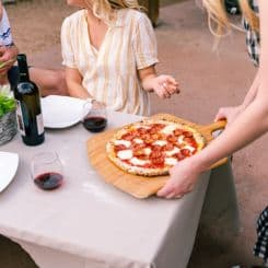 Serving pizza on Ooni 12'' bamboo peel