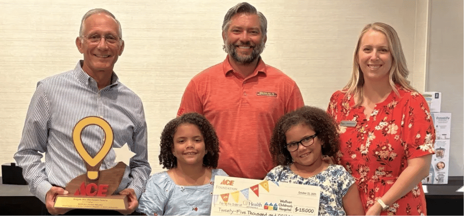 Bill and Jacob Hagan with their local hospital representative and patients