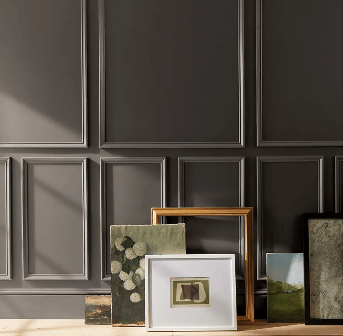 Pictures leaning on a wall painted in Silhouette