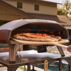  Pizza coming out of oven using Ooni 16'' bamboo peel