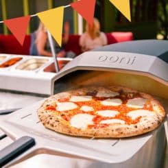 Cheese Pizza coming out of the oven using Ooni 12''perforated pan