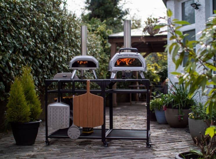 2 ooni pizza ovens sitting on Large modular table