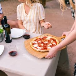 Serving pizza on Ooni 14'' bamboo peel