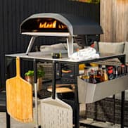 Ooni Koda 16 set up outside with Ooni Peels and table
