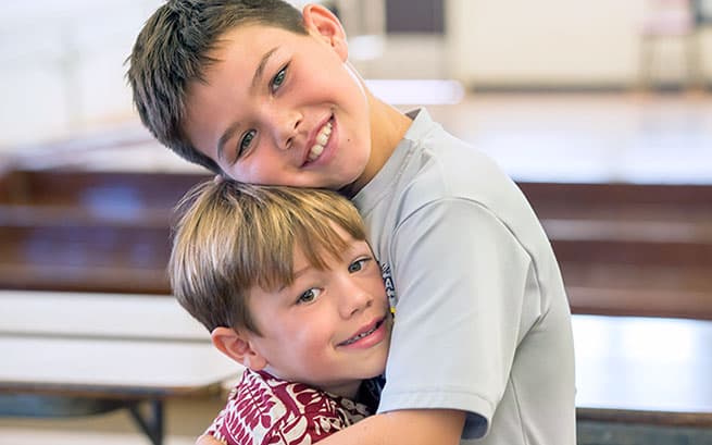 Kopono and Duke in school