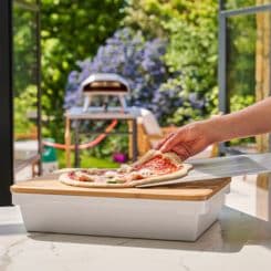 Placing fresh pizza ontop of Ooni Prep lid