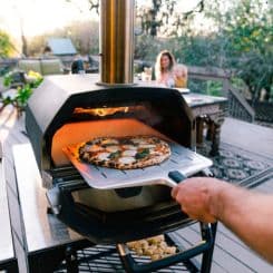 Pizza sliding into oven using Ooni 14'' perforated pan