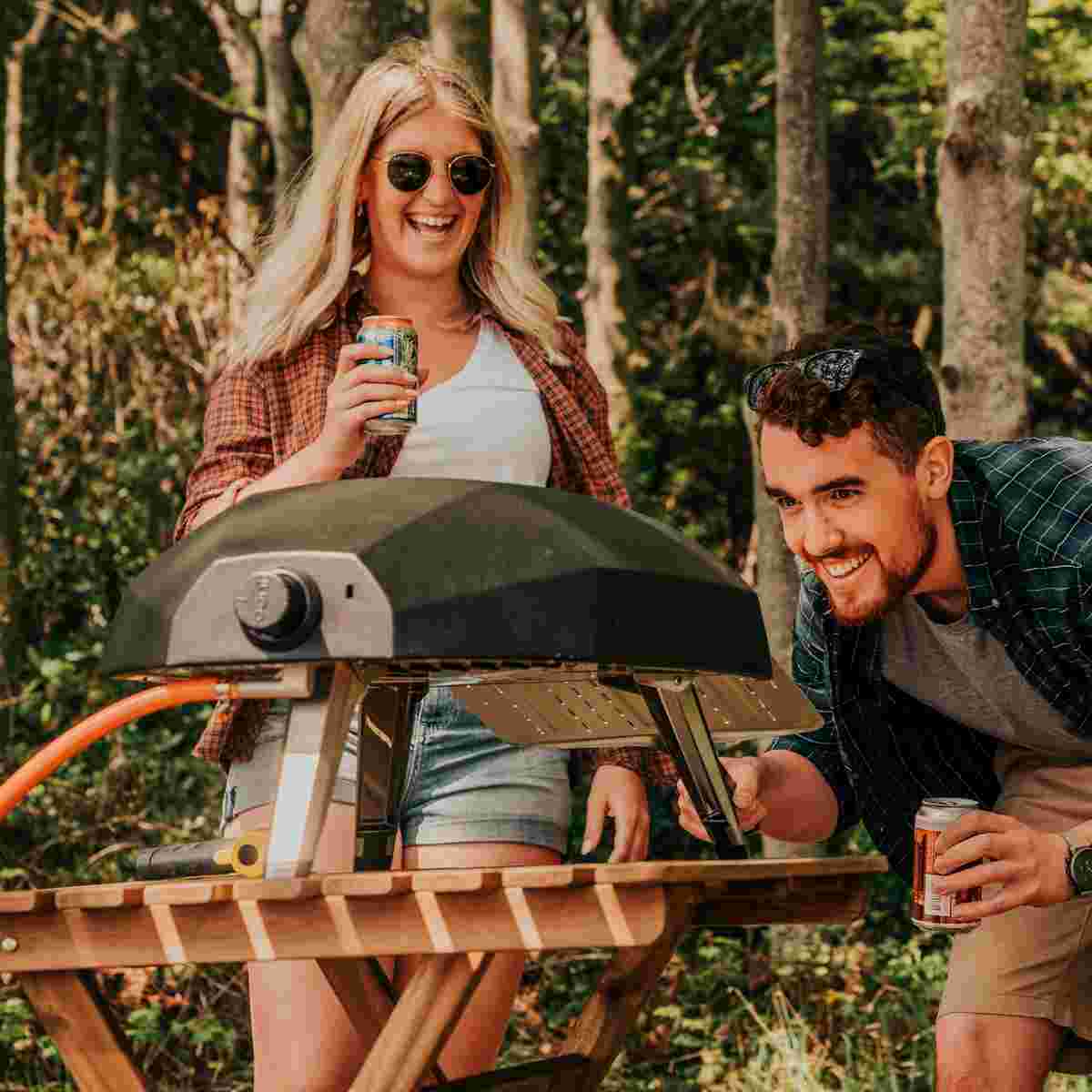 Couple cooking dinner using Ooni Koda 12
