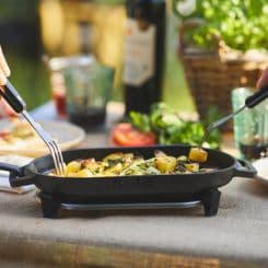  Forks taking food out of Ooni sizzler pan