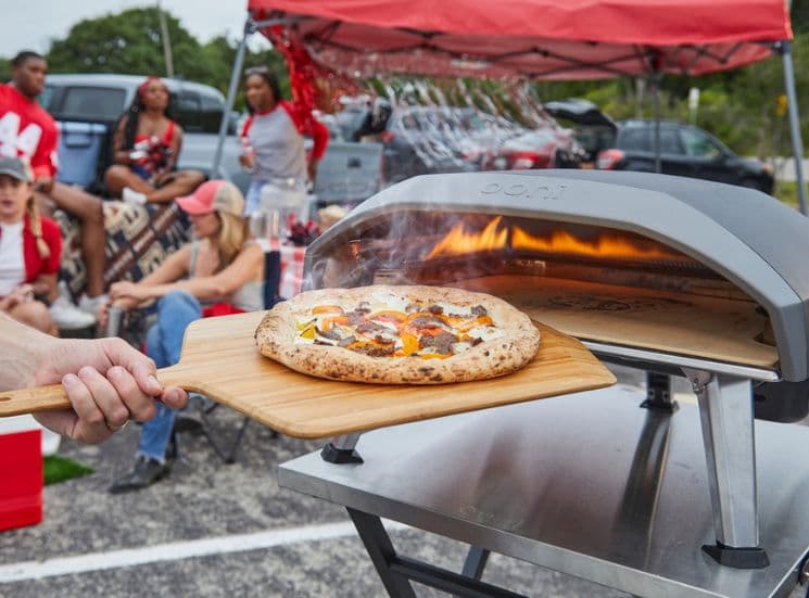 Pizza at tailgate using Ooni 14'' bamboo peel