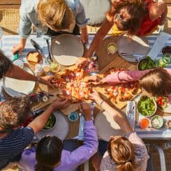  Family enjoying Ooni Neapolitan pizza