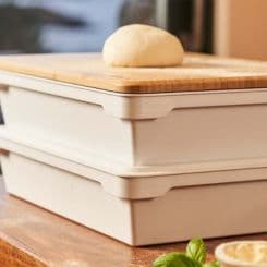 Pizza dough sitting ontop of Ooni dough box