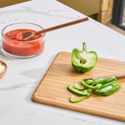 Cut up green peppers on Ooni prep lid