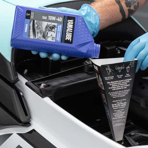 Yamalube oil pouring into engine