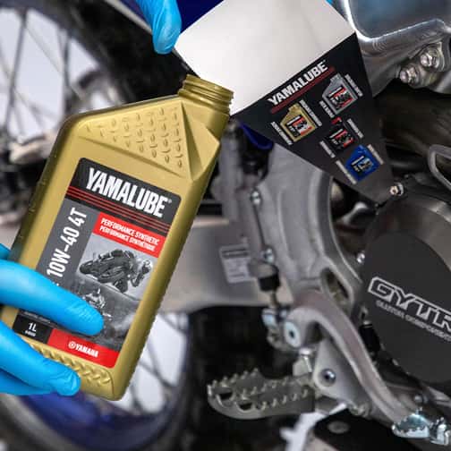 Yamalube oil pouring into engine