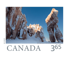 Image of Qarlinngua sea arch and nearby rock formations in Arctic Bay, Nunavut, blanketed in snow, with “Canada” in type and 3.65 rate at the bottom. 