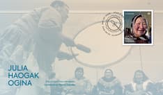 Cover features a photo of the Huqqullaaqatigiit drum dance group, the text “Julia Haogak Ogina”, her stamp, and the cancel mark.