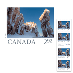 Strip of four stamps featuring image of Qarlinngua sea arch in Arctic Bay, Nunavut.