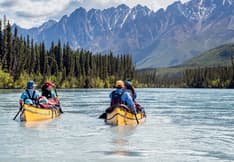 Image of two canoes in the South Nahanni River. Postage Paid mark upper right.