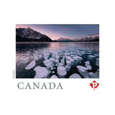  &quot;Far and Wide&quot; collection stamp depicting white methane bubbles in Abraham Lake, Alberta, at dusk. 