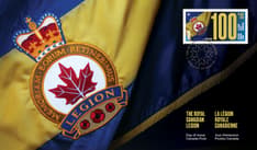 OFDC front shows Legion banner as backdrop, with presentation of Legion badge, stamp, “Day of Issue” text, and service medal cancel mark.