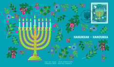 Front of Hanukkah Official First Day Cover. Features a hanukkiyah (Hanukkah menorah) burning with eight white candles and a central helper candle,