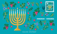 Front of Hanukkah Official First Day Cover. Features a hanukkiyah (Hanukkah menorah) burning with eight white candles and a central helper candle,