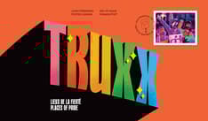 Front of envelope shows “Truxx” in rainbow block letters against an orange background. Stamp top right corner with placard cancel mark.