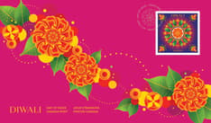 Front of Official First Day Cover. Features a torana garland in orange, yellow, and green, set against a purple-pink background. 