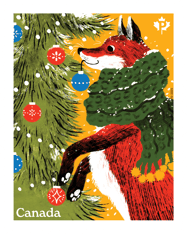 Stamp image depicts a red fox wearing a green scarf decorating a Christmas tree against a yellow background and features “Canada” text