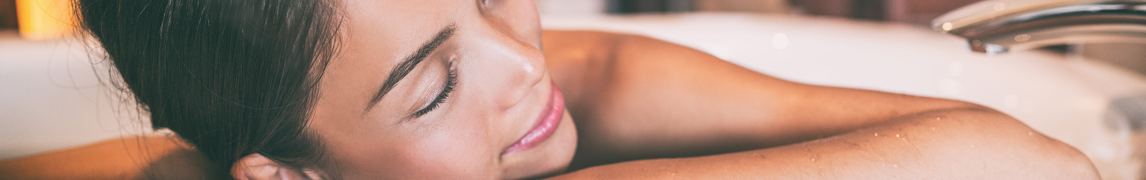 Woman relaxing in luxurious bubble bath