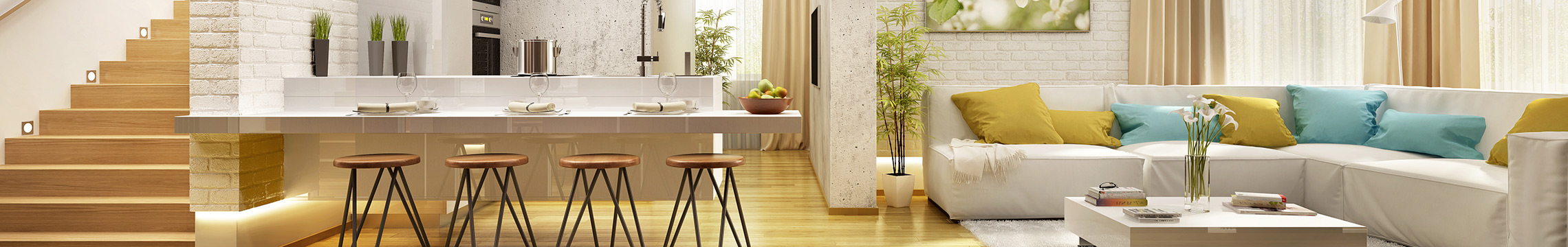 Beautifully furnished living room and kitchen area bathes in warm light