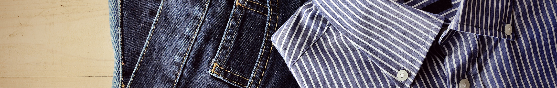 Men's striped Oxford shirt with dark denim and a black leather belt