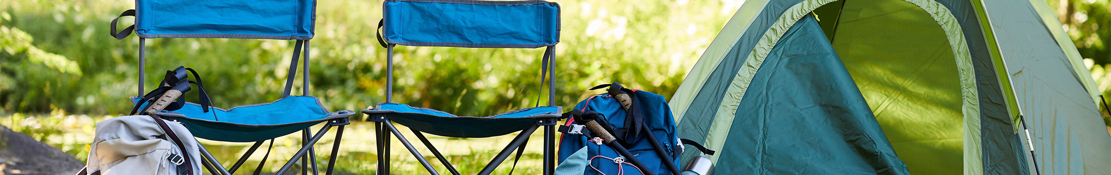 Camp chair with tent, bed roll, and backpack