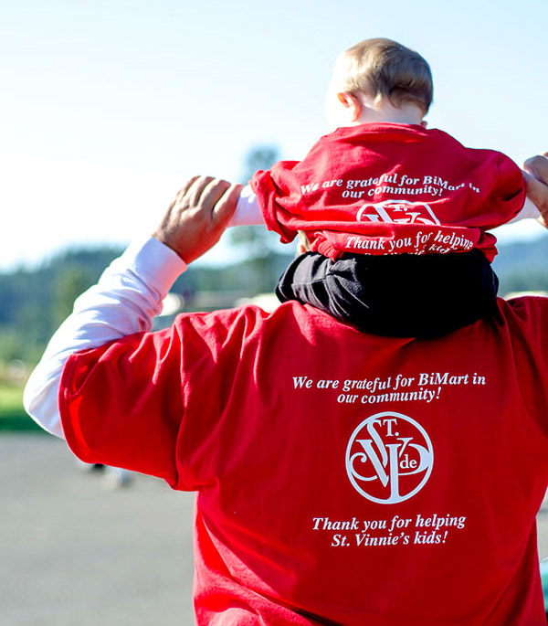 Volunteers at a Bi-Mart charity golf tournament 